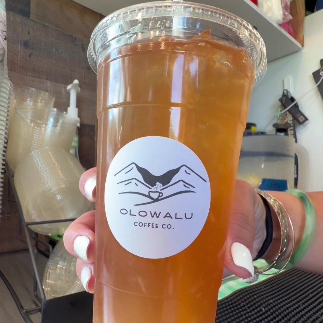 An iced tea and lemonade in an Olowalu Coffee Co cup.
