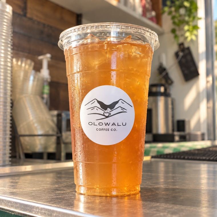 An iced tea and lemonade in an Olowalu Coffee Co cup.