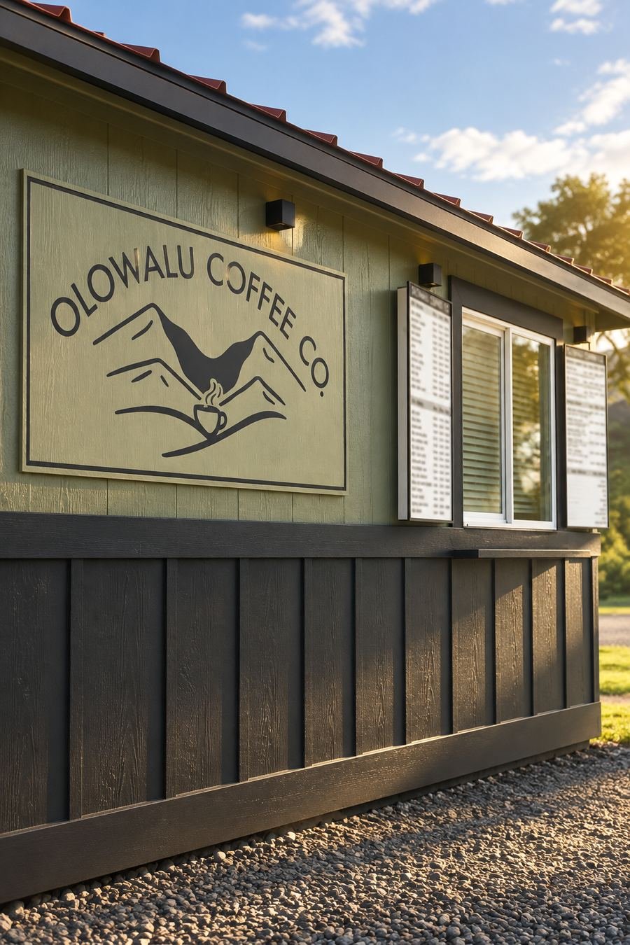 The front of the Olowalu Coffee Co trailer, showing the painted logo above the service window.
