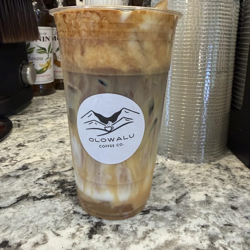 The Mile Marker 14, an iced latte with caramel down the inside of an Olowalu Coffee Co cup.