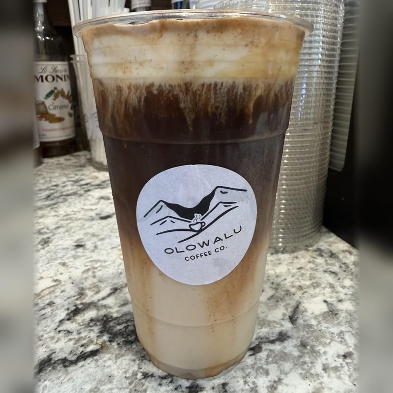 The Mother Reef, an iced latte with the espresso layered over the milk, in an Olowalu Coffee Co cup.